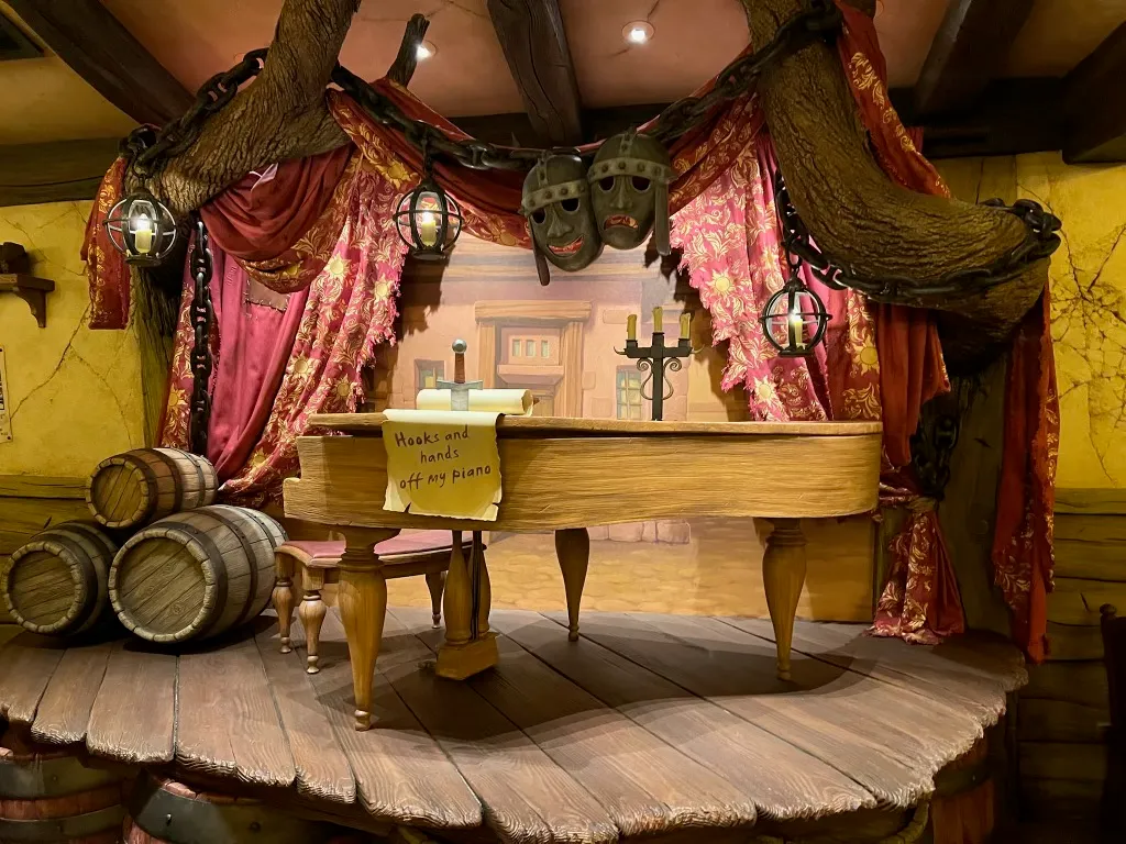 The tavern-themed interior of The Snuggly Duckling restaurant at Fantasy Springs, Tokyo DisneySea, styled after the pub from Tangled